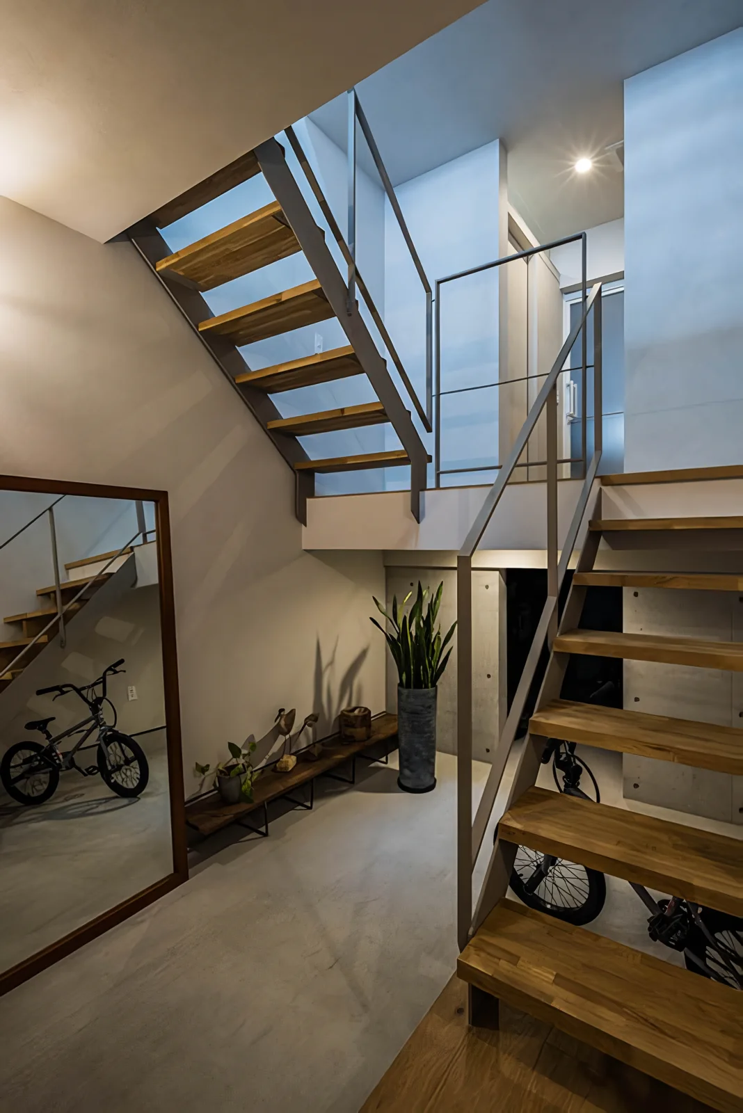 The 1.5-floor level houses the wet areas and connects further to the second-floor living room