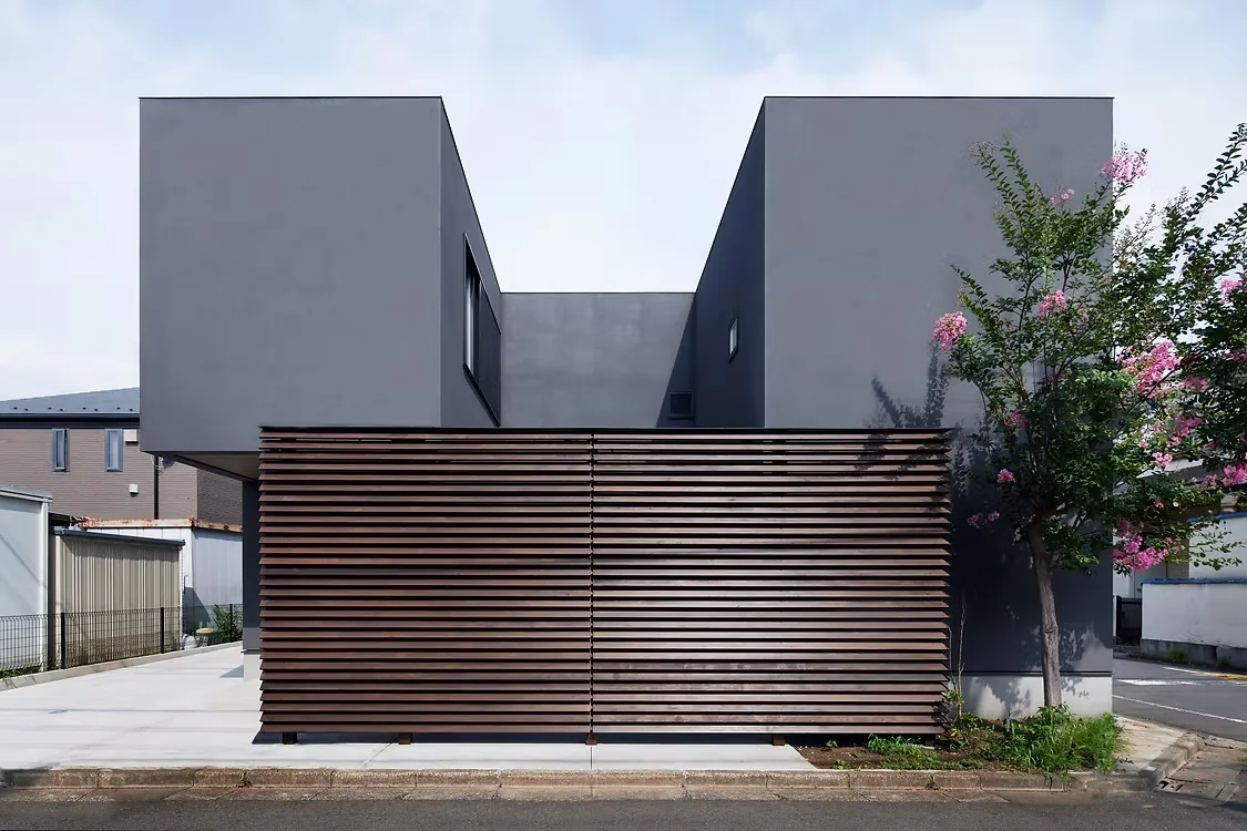 The building volume is designed to enclose a courtyard, maximizing site usage by utilizing the corner lot relaxation provision.
