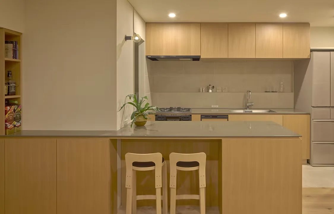 Savoring special moments with drinks in a modern kitchen setting.