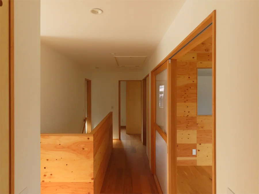 House on a Sloped Site with a Bridge