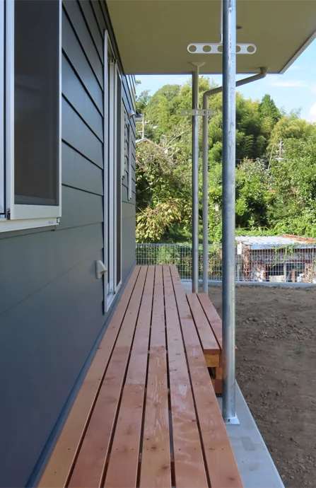 House on a Sloped Site with a Bridge
