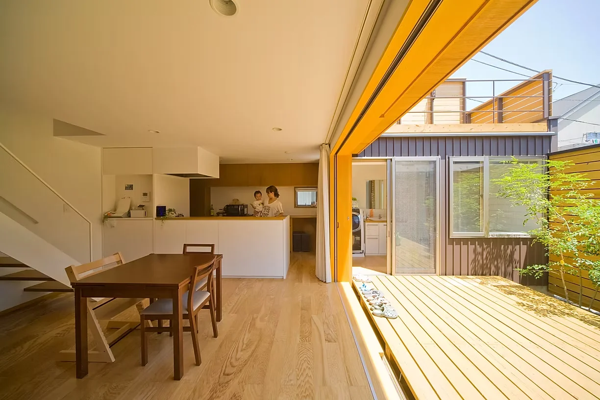 The dining area connects seamlessly with the courtyard, creating a sense of openness